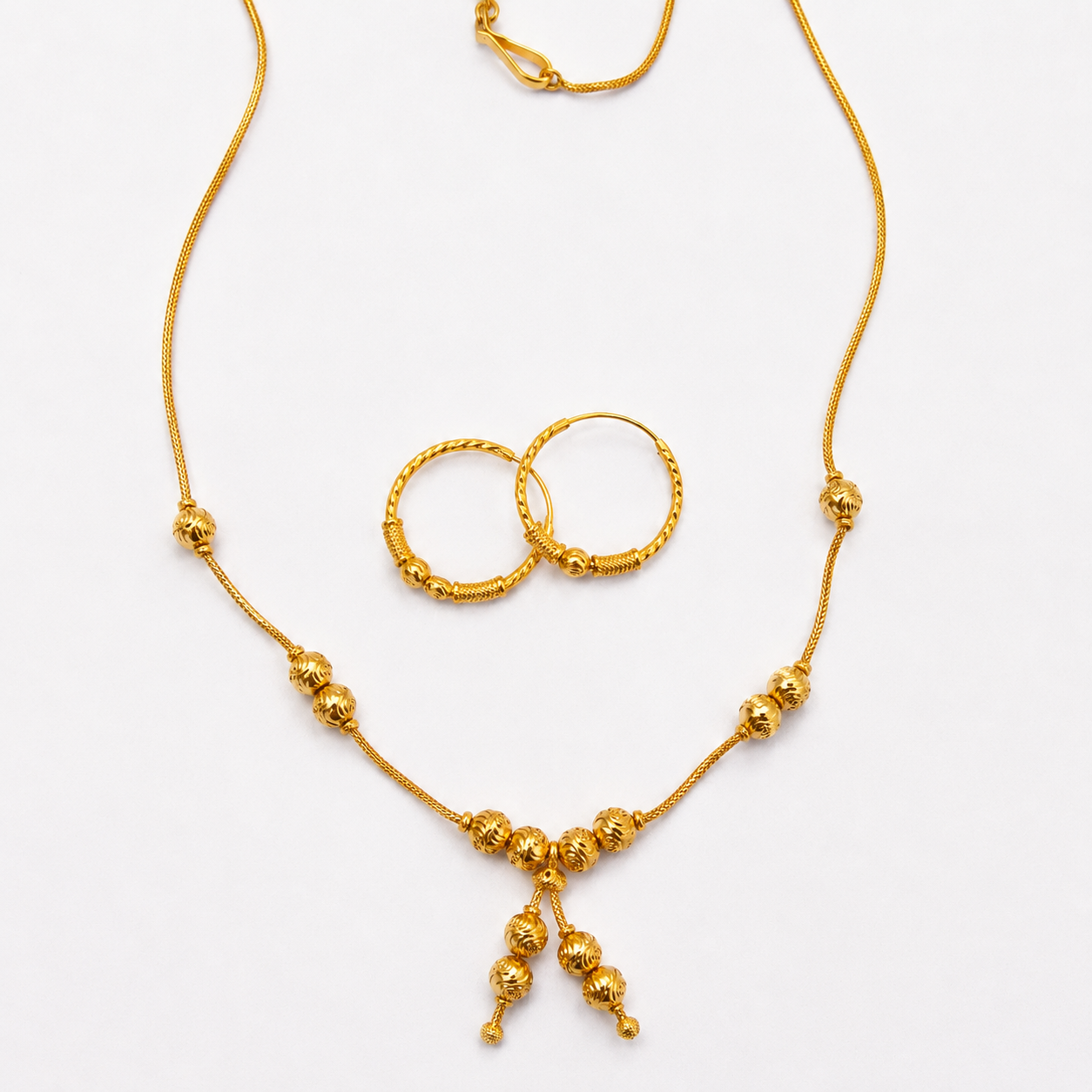 Ensemble Collier et Boucles d'oreilles en or 21 carats - 12.11G